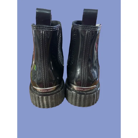 Women's Michael Kors black patent Lulu PVC Chelsea boot with stud accents.